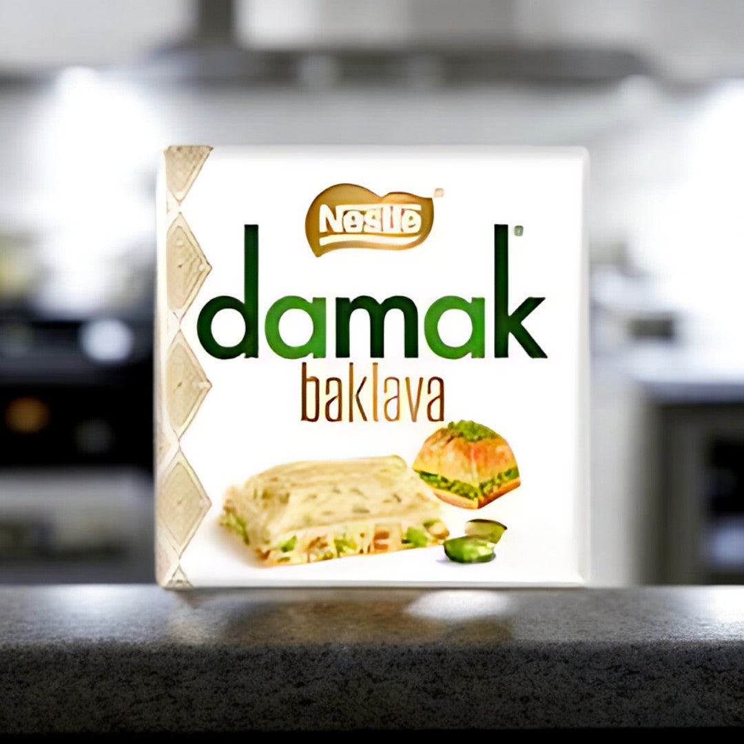 Damak Baklava 60g  Knusprige Filoteigblätter gefüllt mit aromatischen Nüssen, köstlichem Sirup und feinem Honig - ein Stück Orient für Zuhause!