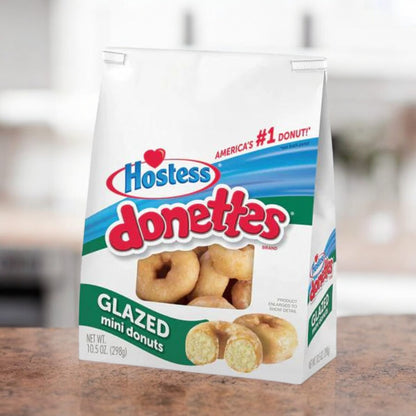 Hostess Donettes Glazed 298g, kleine, ringförmige Donuts mit süßer Glasur, ideal für Frühstück oder Snack.