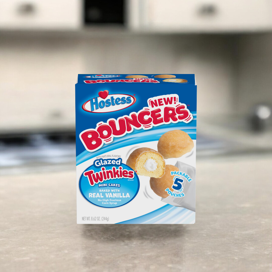 Hostess Bouncers - Glazed Twinkies: Kleine, glasierte Twinkie-Happen mit weichem Kuchen und cremiger Füllung, ideal für unterwegs.